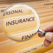 Insurance folders with magnifying glass.
